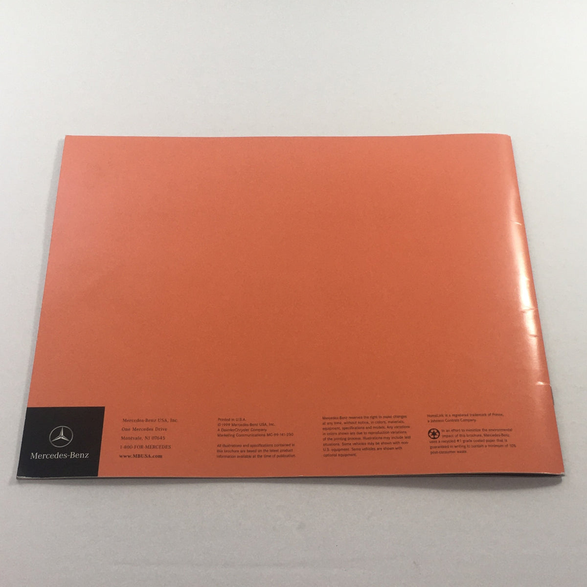 Back cover of the 2000 Mercedes-Benz CLK-Class Dealership Car Auto Brochure Catalog, featuring a minimalist orange design and Mercedes-Benz branding.