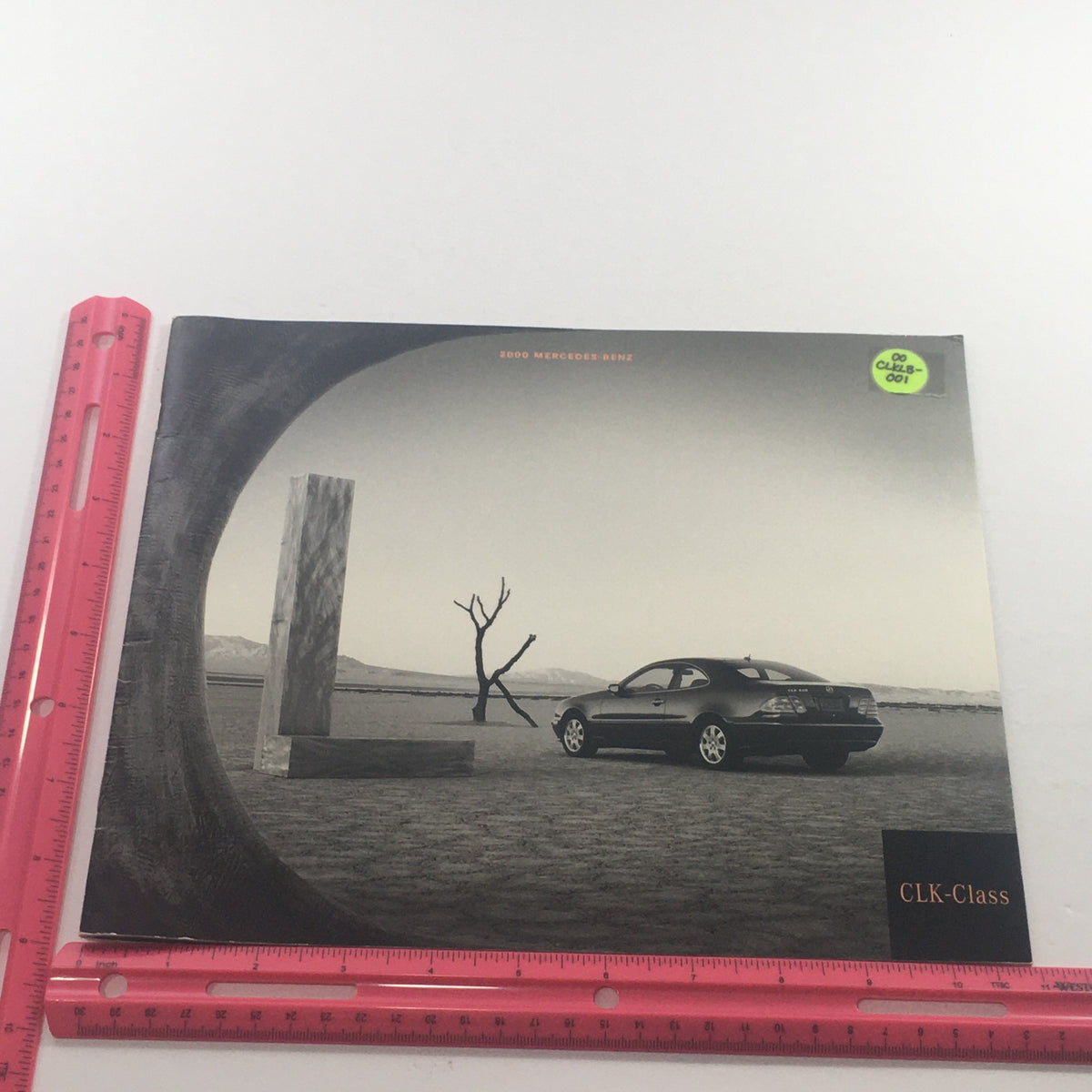 Front cover of the 2000 Mercedes-Benz CLK-Class Dealership Car Auto Brochure Catalog, showcasing a sleek CLK-Class car in a scenic black and white setting, highlighted with a 'CLK-Class' label.