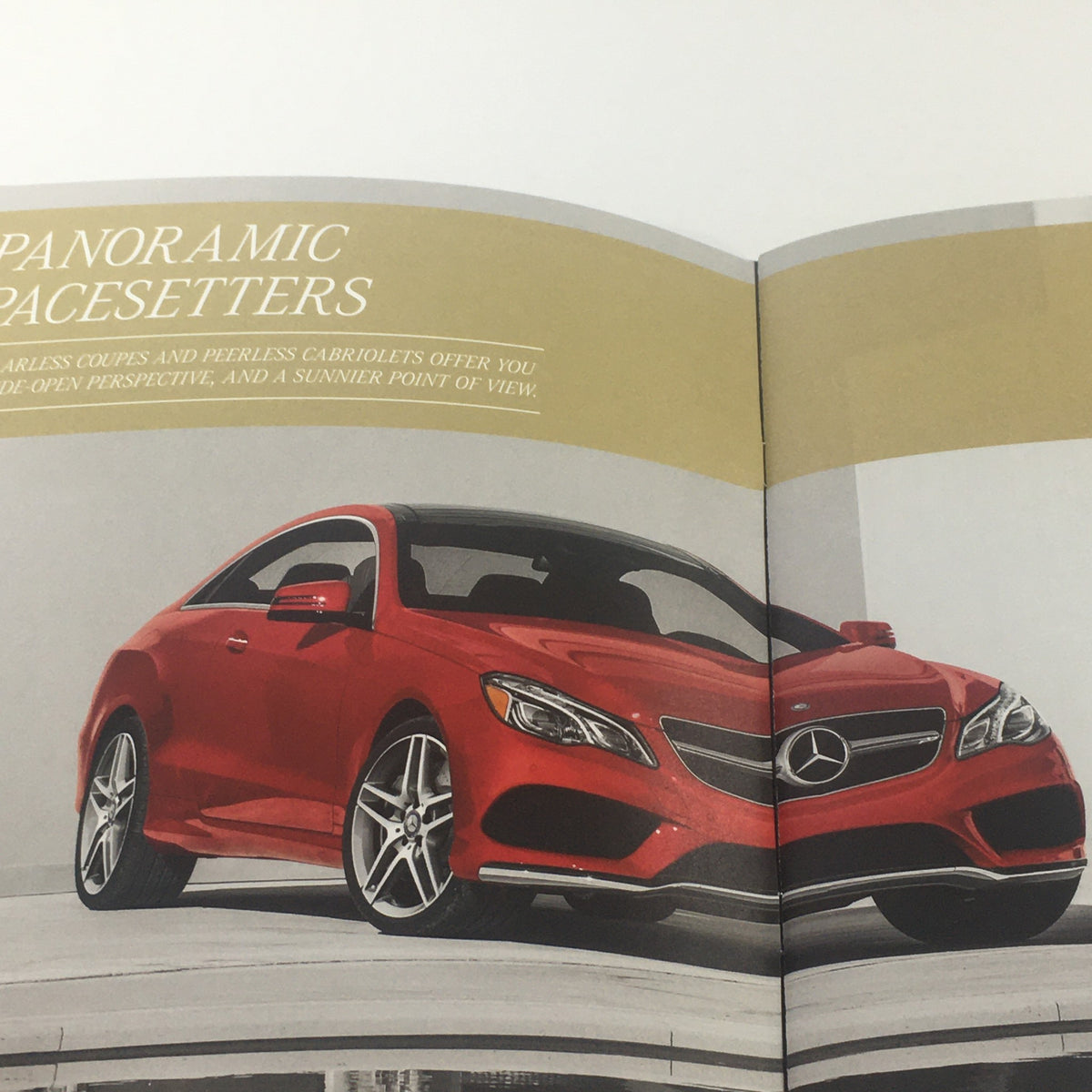 2016 Mercedes-Benz E-Class Coupe promotional image showcasing a red coupe against a stylish background, part of the dealership car auto brochure catalog.