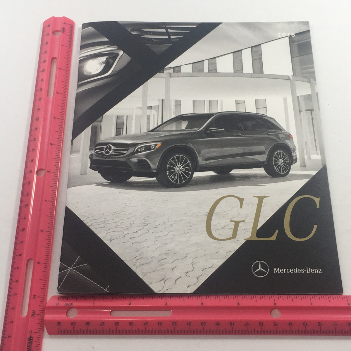 Cover of the 2016 Mercedes-Benz GLC-Class Polished Mettle Dealership Auto Brochure Catalog displaying the GLC model with stylish design elements.