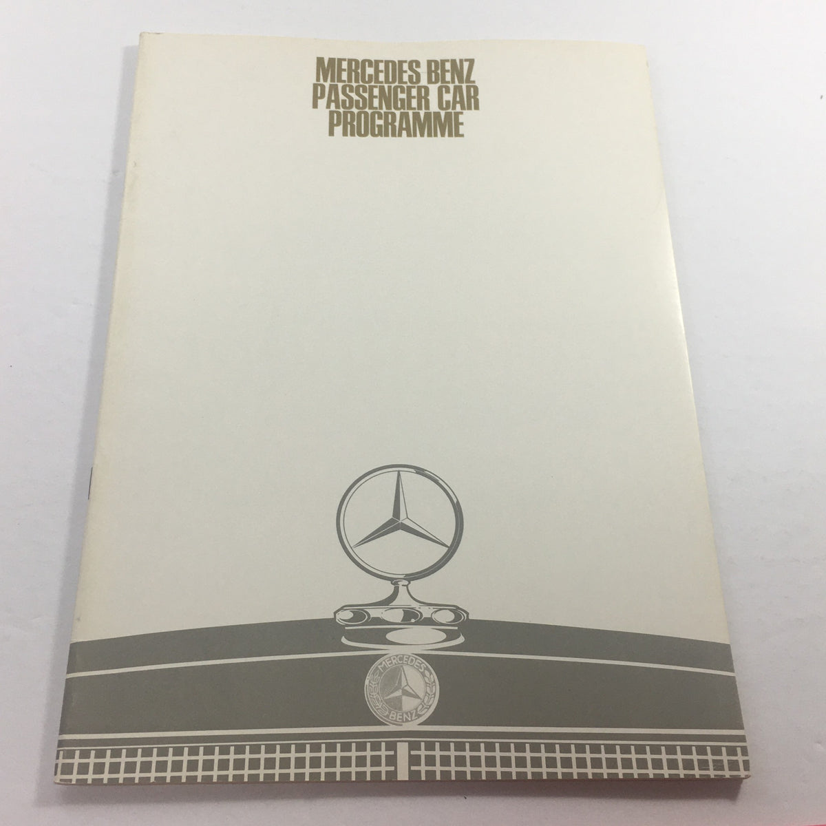 Cover of the 1960s Mercedes-Benz 220-D Program Passenger Dealership Auto Brochure Catalog featuring the Mercedes-Benz emblem and a sleek design.