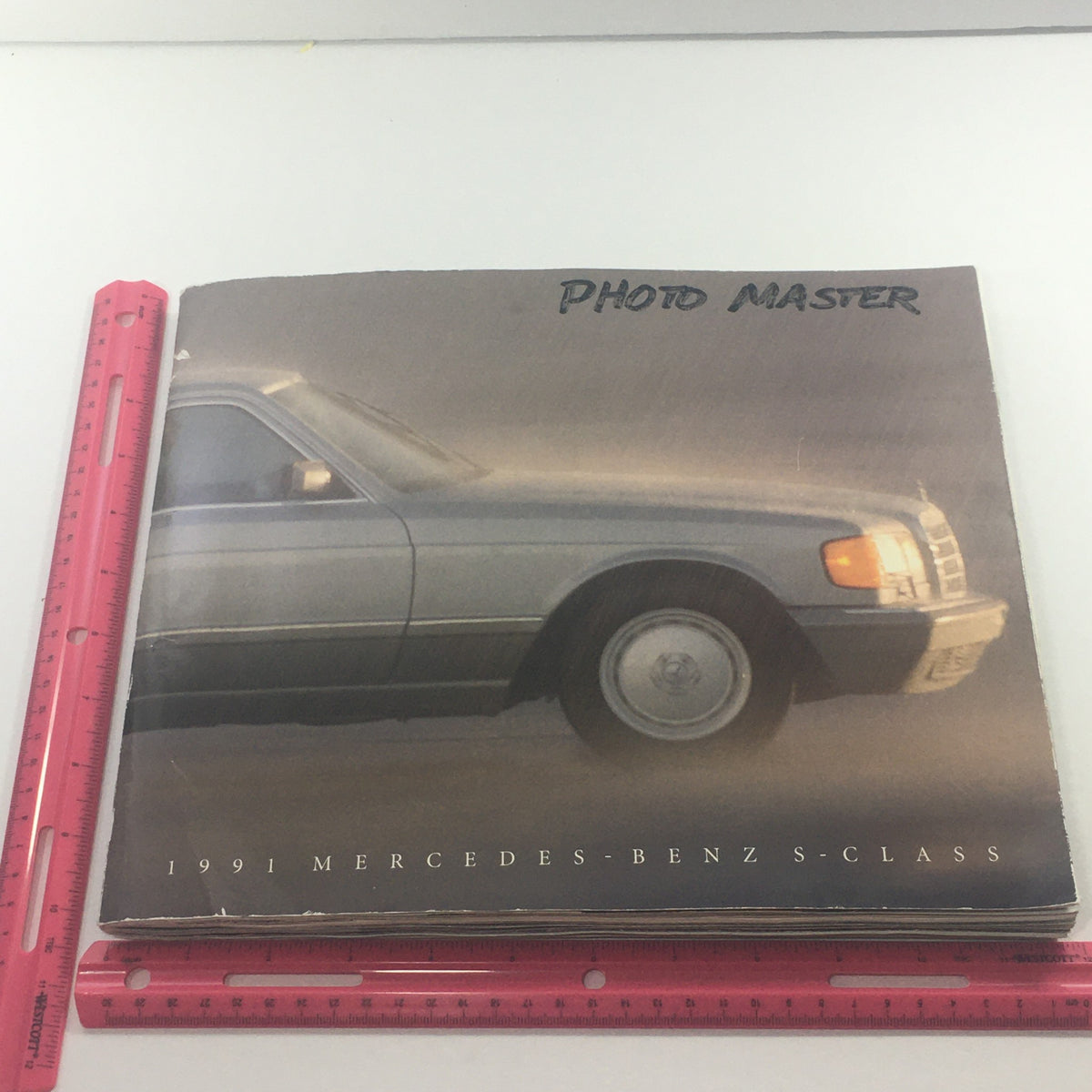 Cover of the 1991 Mercedes-Benz S-Class 300 SE-Sedan Dealership Car Auto Brochure Catalog with 'Photo Master' title and image of the car.