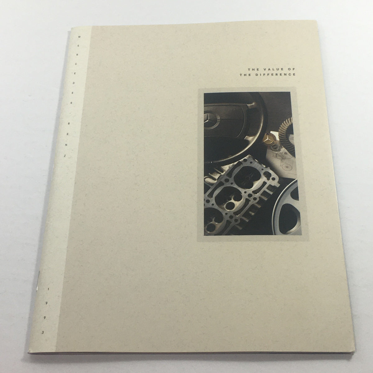 Cover of the 1993 Mercedes-Benz The Value Of Difference Dealership Car Auto Brochure Catalog featuring detailed automotive components and a stylish design.