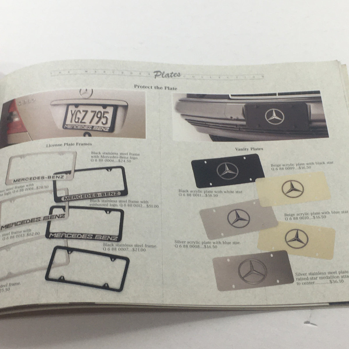 Inside page of the 1994 Mercedes-Benz Collection Accessories Dealership Car Auto Brochure Catalog illustrating license plate frames and vanity plates for Mercedes-Benz vehicles.