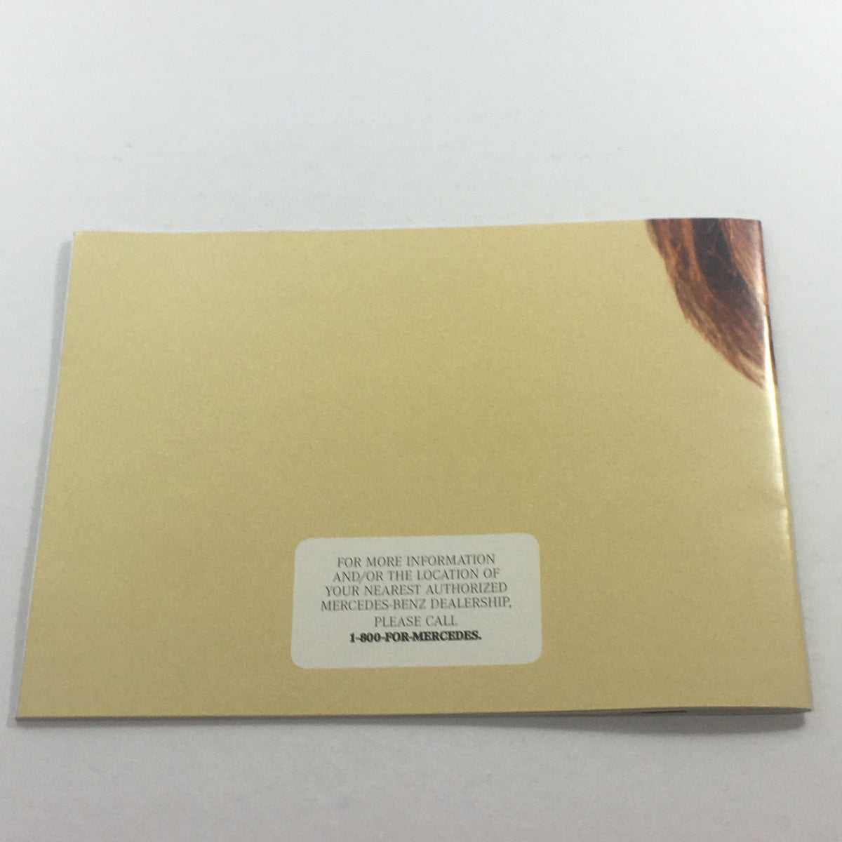Back cover of the 1994 Mercedes-Benz Collection Accessories Dealership Car Auto Brochure Catalog. Features a light yellow background with a contact statement for inquiries regarding authorized dealerships.
