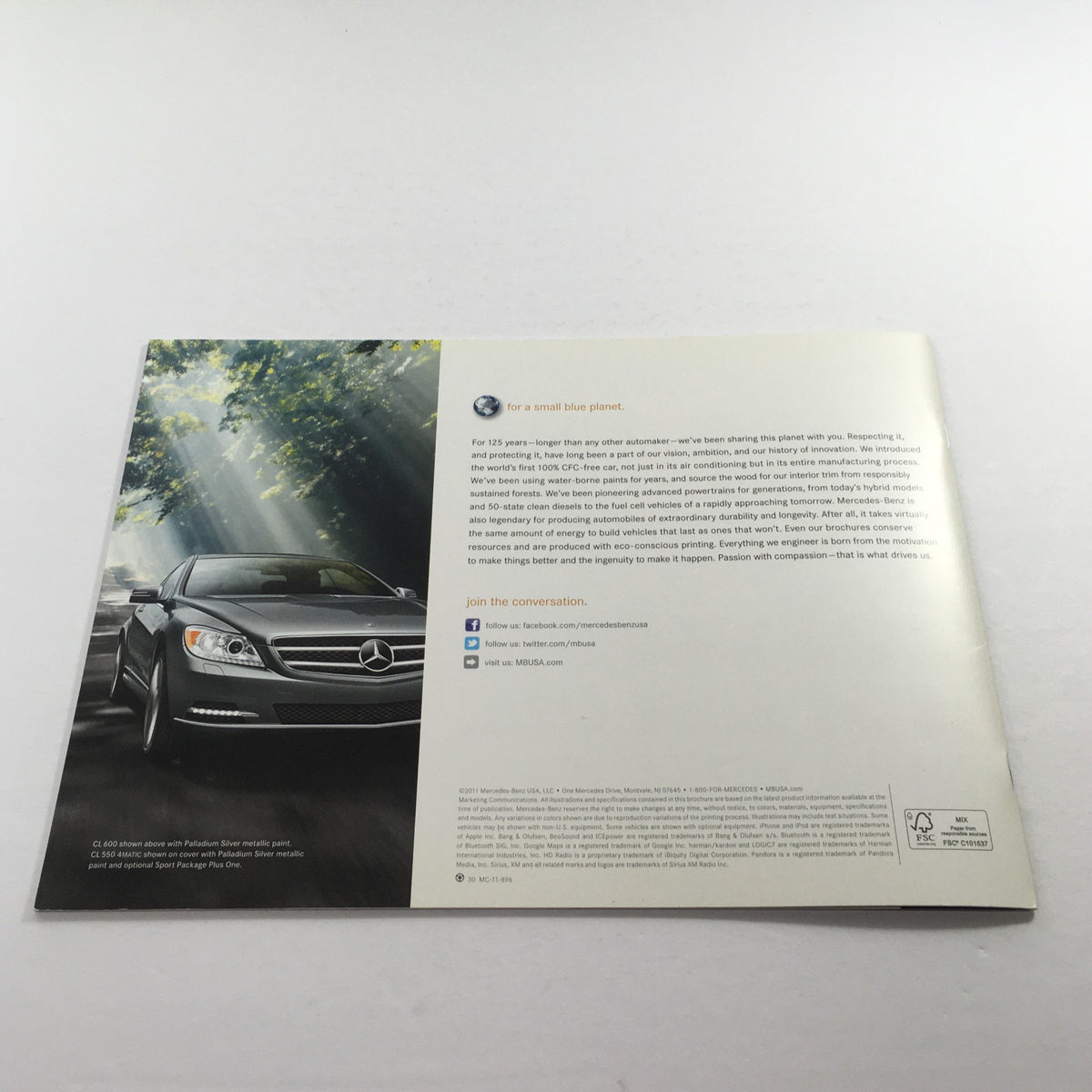 Back cover of the 2012 Mercedes-Benz CL-Class CL550 brochure, featuring a silver coupe under soft sunlight with a message about sustainability.