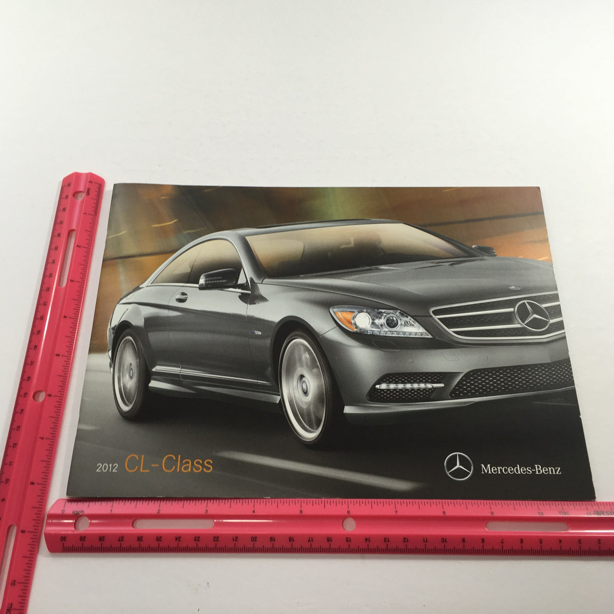 2012 Mercedes-Benz CL-Class CL550 Dealership Car Auto Brochure Catalog featuring the sleek design of the vehicle on the cover, showcasing the luxury and elegance associated with the Mercedes-Benz brand.
