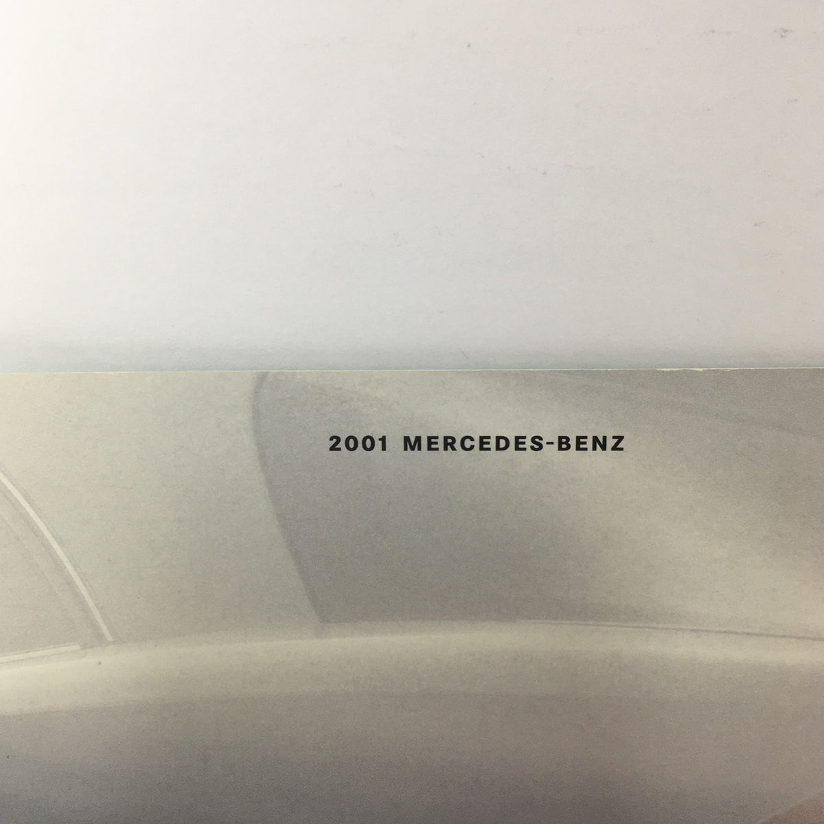 2001 Mercedes-Benz CL-Class Dealership Car Auto Brochure Catalog highlighting the brand name and logo, emphasizing the luxurious identity of the car.