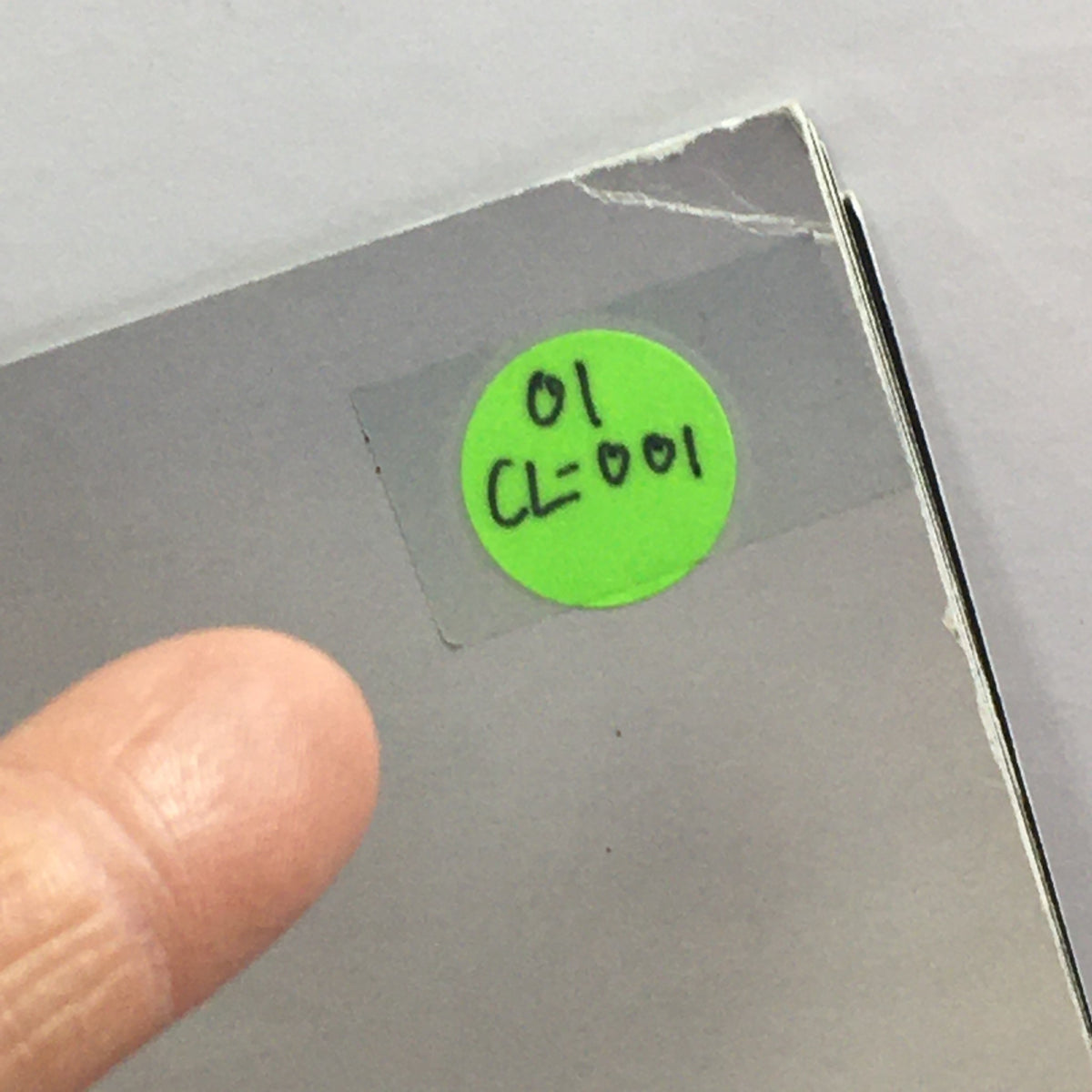 Close-up shot of a sticker on the 2001 Mercedes-Benz CL-Class Dealership Car Auto Brochure Catalog.