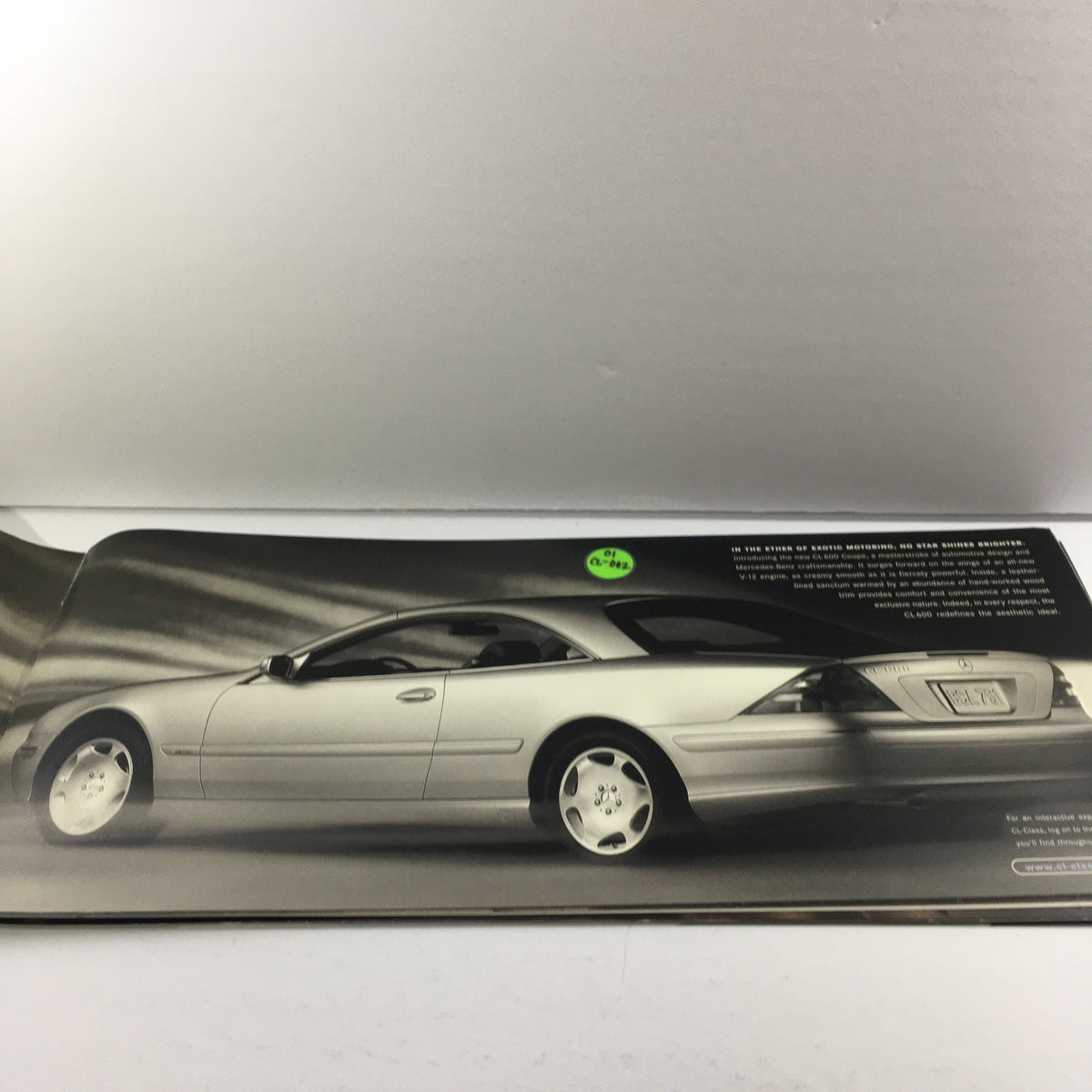 Interior view showcasing a silver 2001 Mercedes-Benz CL-Class car in the brochure.
