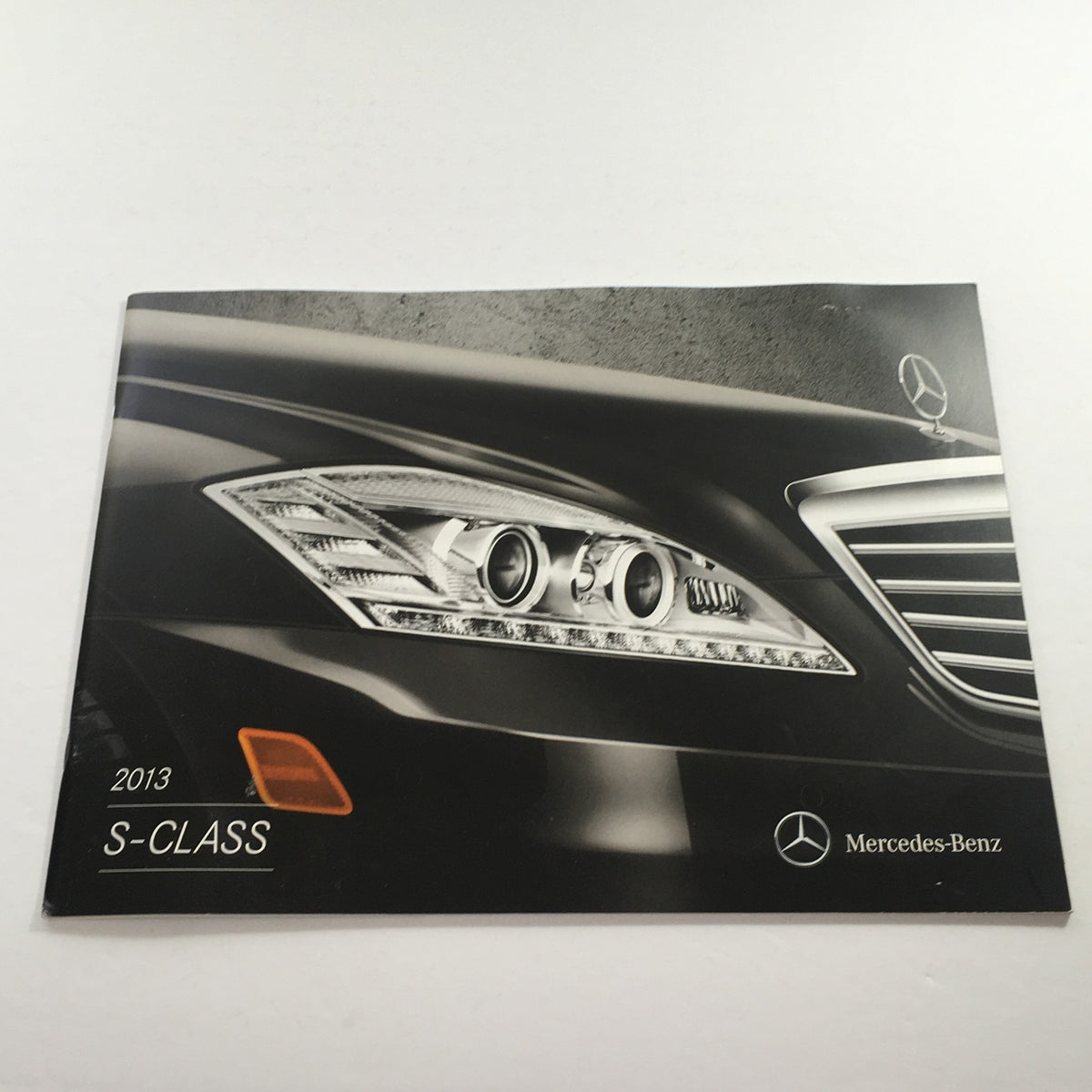 2013 Mercedes-Benz S-Class Dealership Car Auto Brochure Catalog cover showcasing the sleek design of the car's front headlights.
