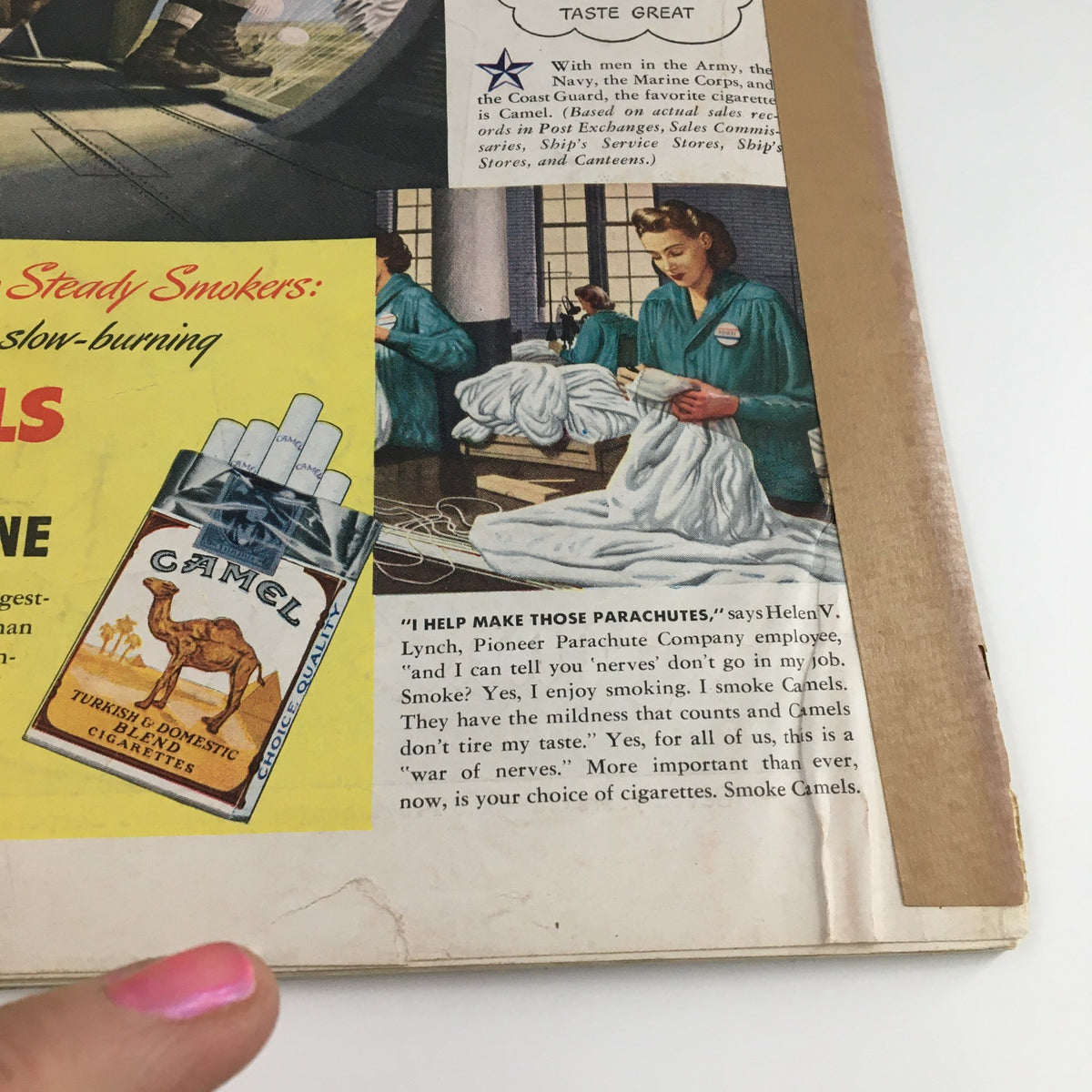 Interior view of a magazine page from Time Magazine June 29 1942 Vol 39 #26 featuring an advertisement for Camel cigarettes and women making parachutes, highlighting World War II era themes.
