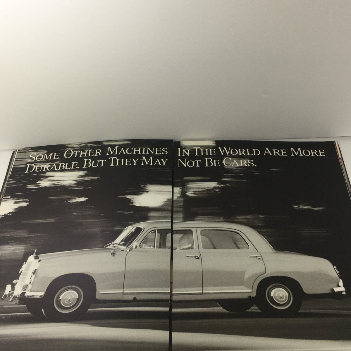 Open spread from the 1992 Mercedes-Benz Value of Difference Dealership Car Auto Brochure Catalog showcasing a classic Mercedes-Benz vehicle with the tagline emphasizing durability and distinction compared to other machines.