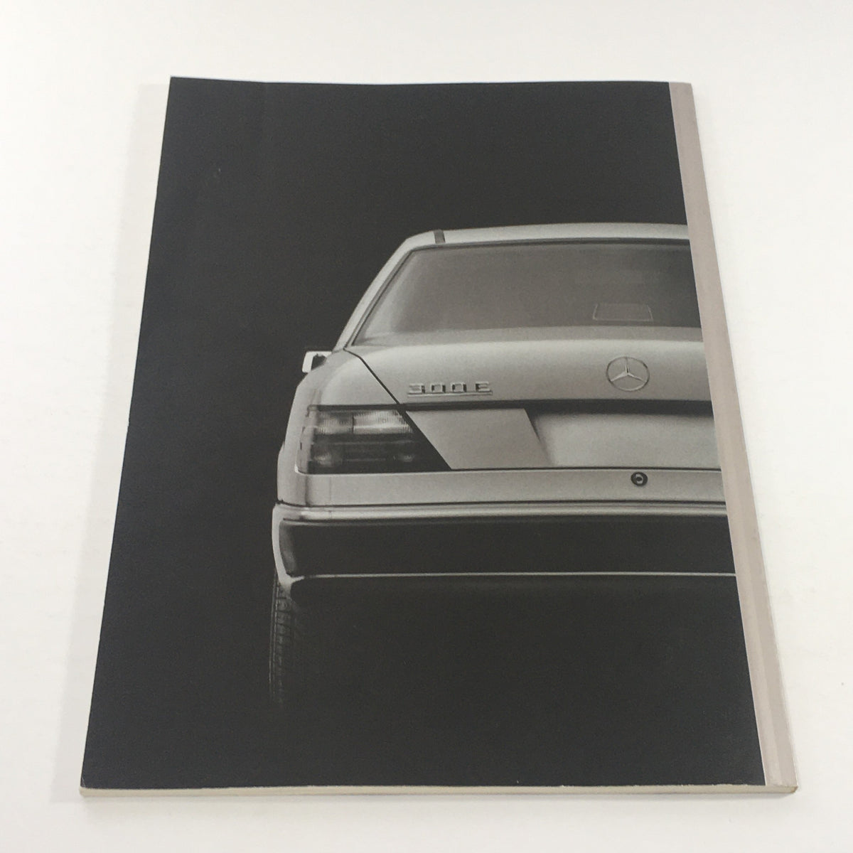 Back cover of the 1992 Mercedes-Benz 300-Class Dealership Car Auto Brochure Catalog, featuring the Mercedes-Benz logo on a classic car design.