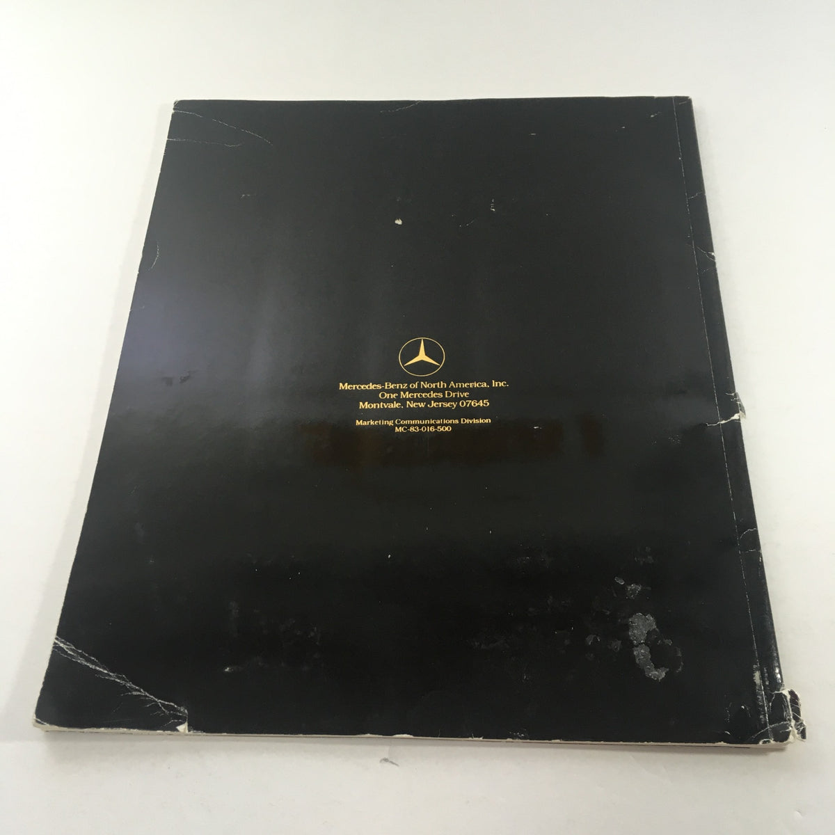Back cover of the vintage 1984 Mercedes-Benz 190E 2.3/190D 2.2 Sedans Dealership Car Auto Brochure Catalog with original branding.