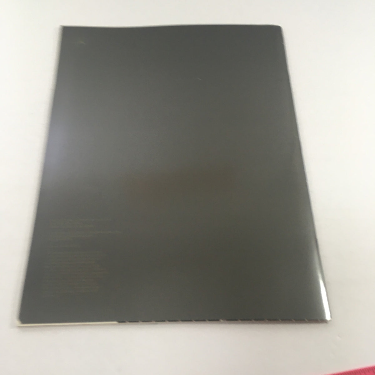Back cover of the 1989 Mercedes-Benz 190-Class 190E 2.6 Sedan Dealership Car Auto Brochure Catalog, featuring a clean gray design.