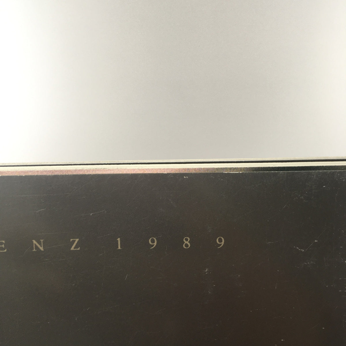 Close-up view of the bottom of the 1989 Mercedes-Benz 190-Class 190E 2.6 Sedan Dealership Car Auto Brochure Catalog displaying the year and brand.