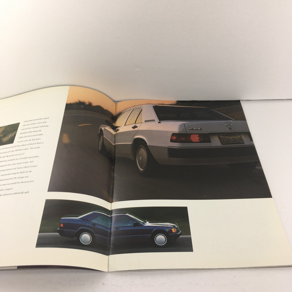 1989 Mercedes-Benz 190-Class Sedan Dealership Car Auto Brochure featuring images of the car in motion, illustrating its stylish design and performance.