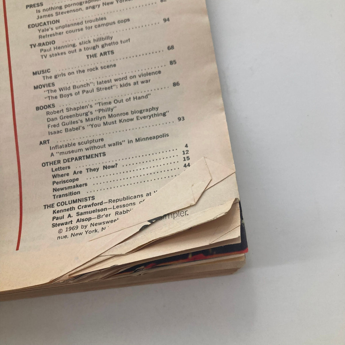 Close-up of the age-worn spine of VTG Newsweek Magazine July 14 1969, showing signs of wear and detailing the magazine's historical significance.