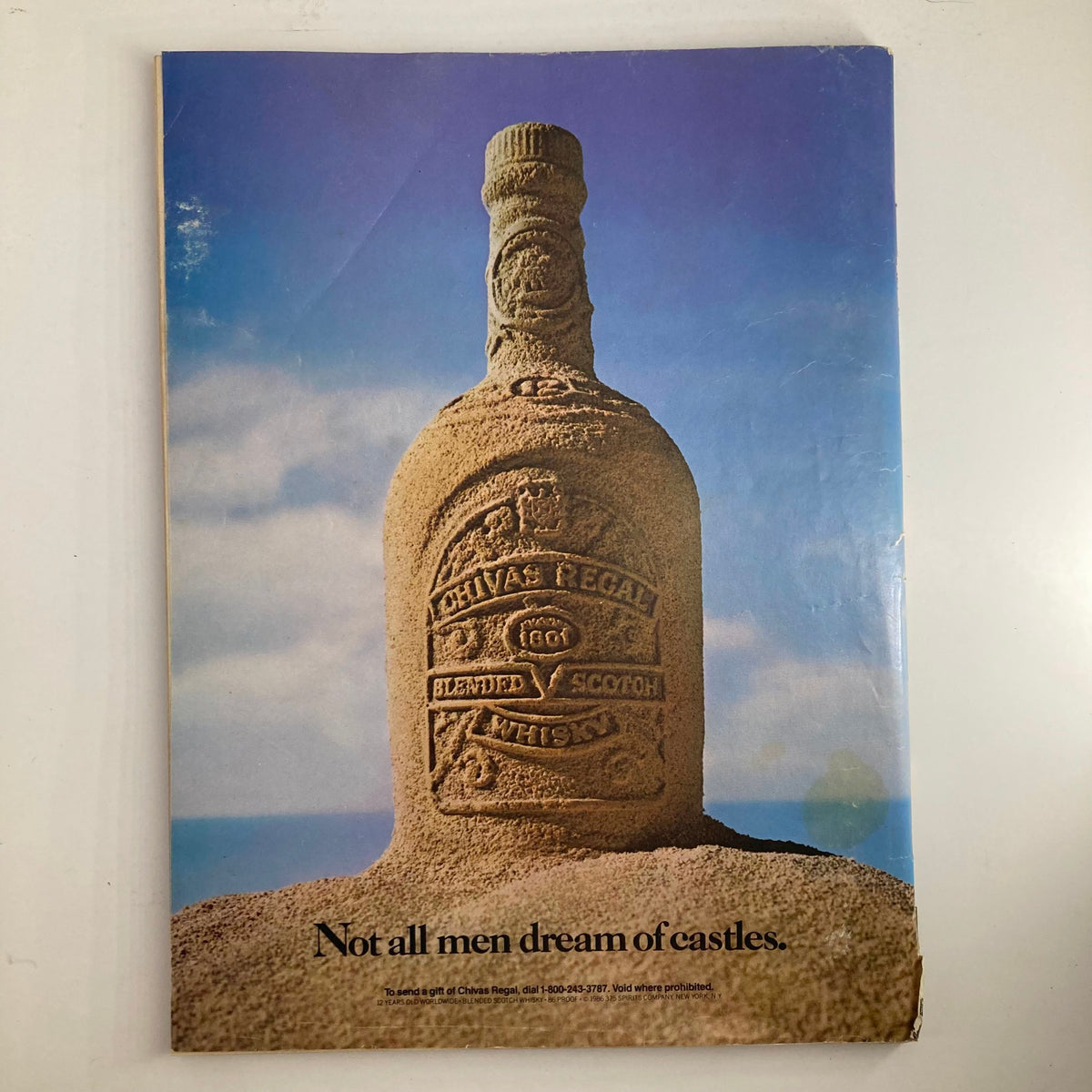 VTG Sports Illustrated magazine February 9 1987 featuring Elle Macpherson cover, showcasing a vintage advertisement of a Chivas Regal whiskey bottle shaped like a sandcastle, with the text 'Not all men dream of castles.'