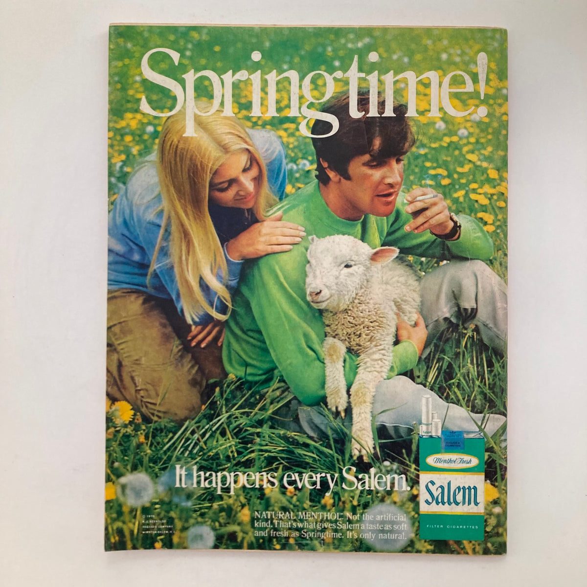 Vintage advertisement page from the 1970s featuring a couple in a field with a lamb, promoting Salem cigarettes, reflecting the era's advertising style.