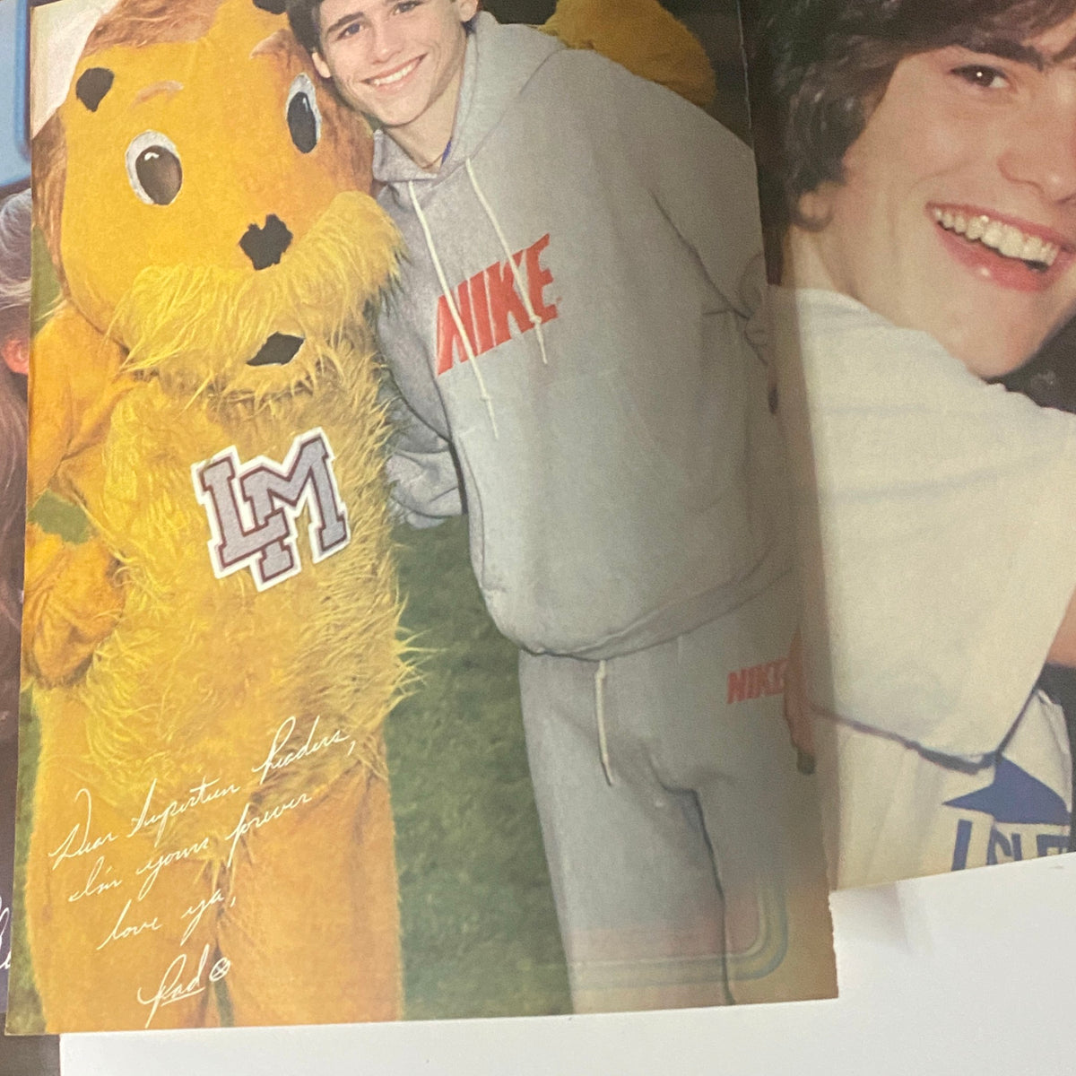 A colorful interior page from SuperTeen Magazine November 1980 showing a boy in a Nike outfit posing with a mascot, highlighting the fun aspects of teen culture.