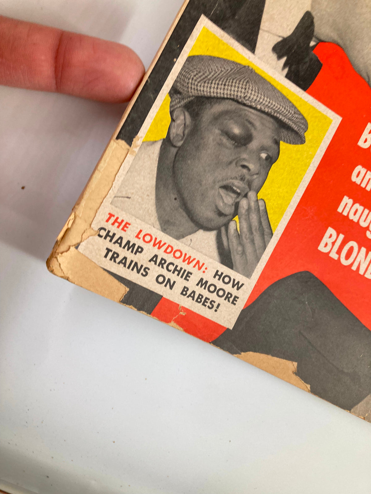Close-up of VTG Confidential Magazine July 1956 displaying the feature article on boxer Archie Moore, highlighting a sensational story with a vintage aesthetic.