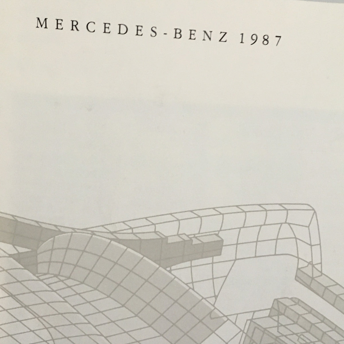 Close-up view of the title on the 1987 Mercedes-Benz S-Class Specifications Dealership Car Auto Brochure Catalog, showcasing the design and branding.