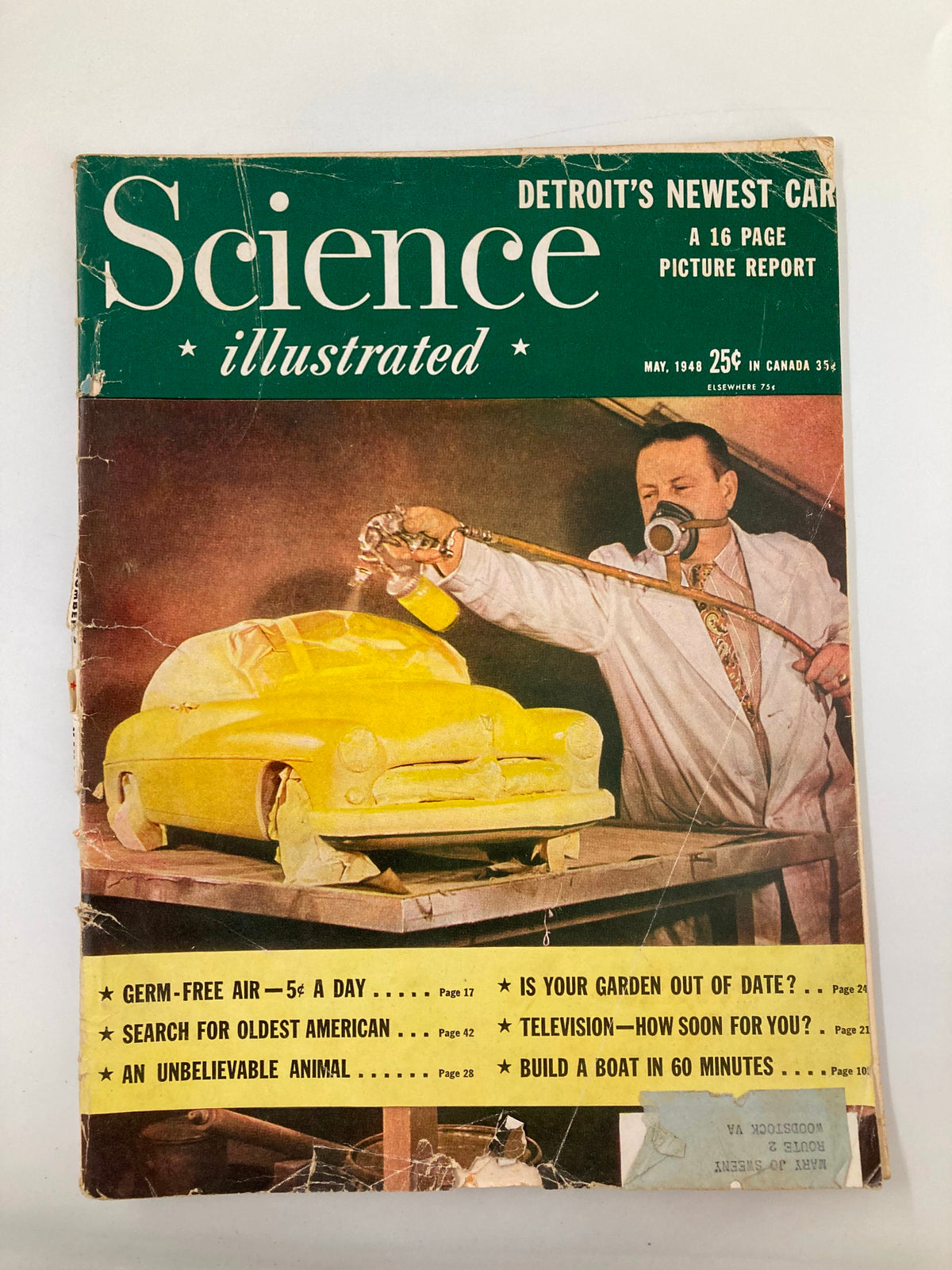 Cover of VTG Science Illustrated Magazine May 1948 showcasing Detroit's Newest Car Picture Report, featuring a yellow car model, a man in a lab coat, and bold text highlighting the magazine's contents.