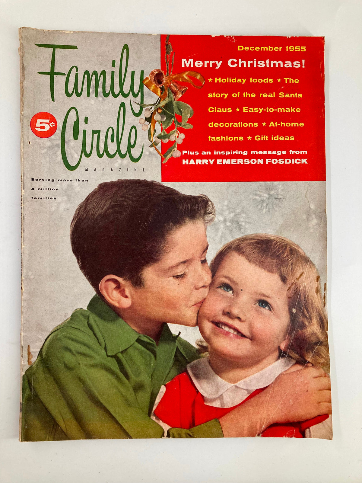 Vintage Family Circle Magazine cover from December 1955 featuring the title "Merry Christmas!" along with the story of the Real Santa Claus, set against a nostalgic holiday background with children.