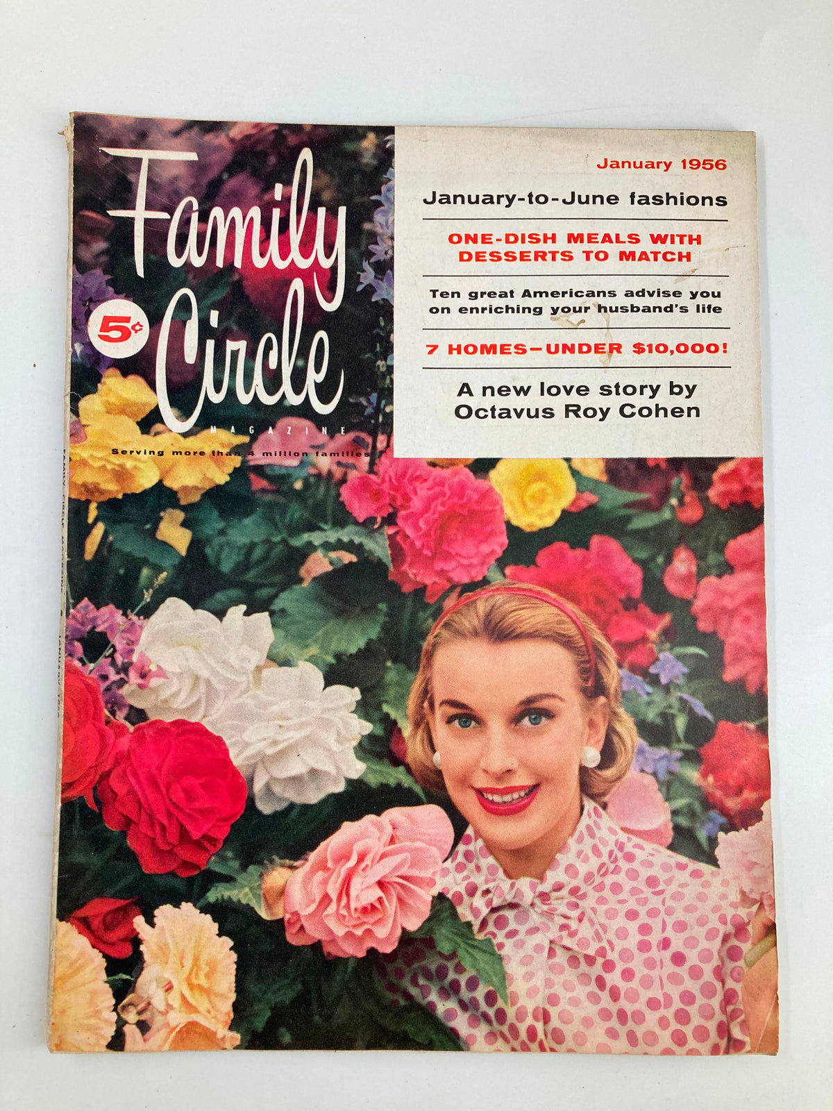 Cover of VTG Family Circle Magazine January 1956 featuring vibrant flowers and a smiling woman in polka dot attire, emphasizing its vintage charm.