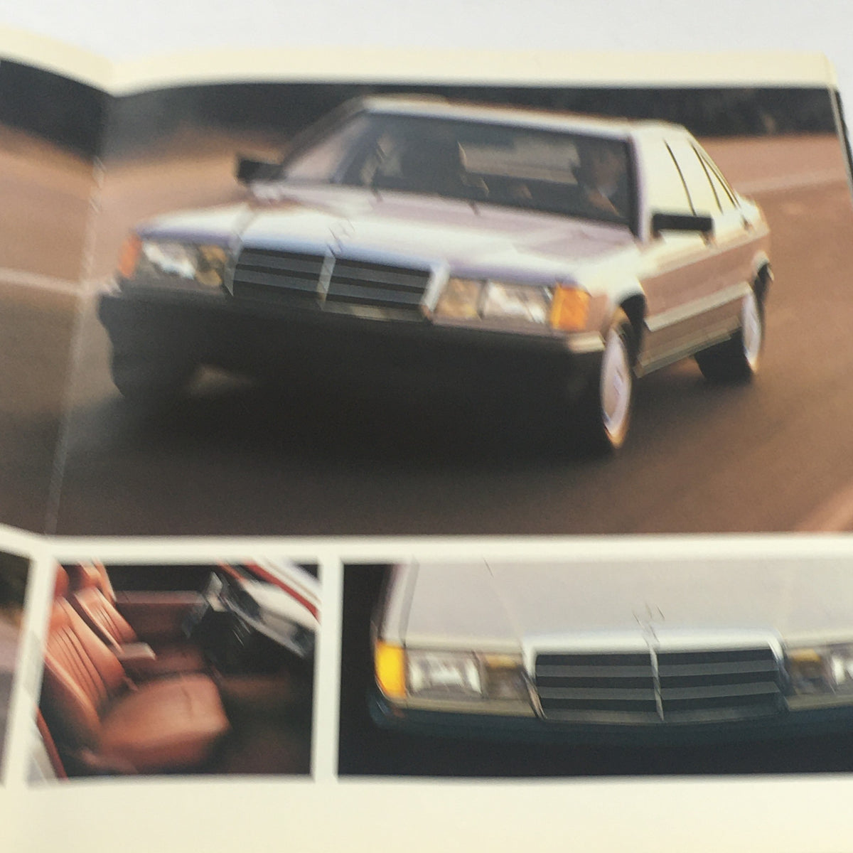 Inside page of the 1987 Mercedes-Benz Full Model Line Dealership Car Auto Brochure Catalog showcasing a Mercedes-Benz car on the road and details of the vehicle's interior.