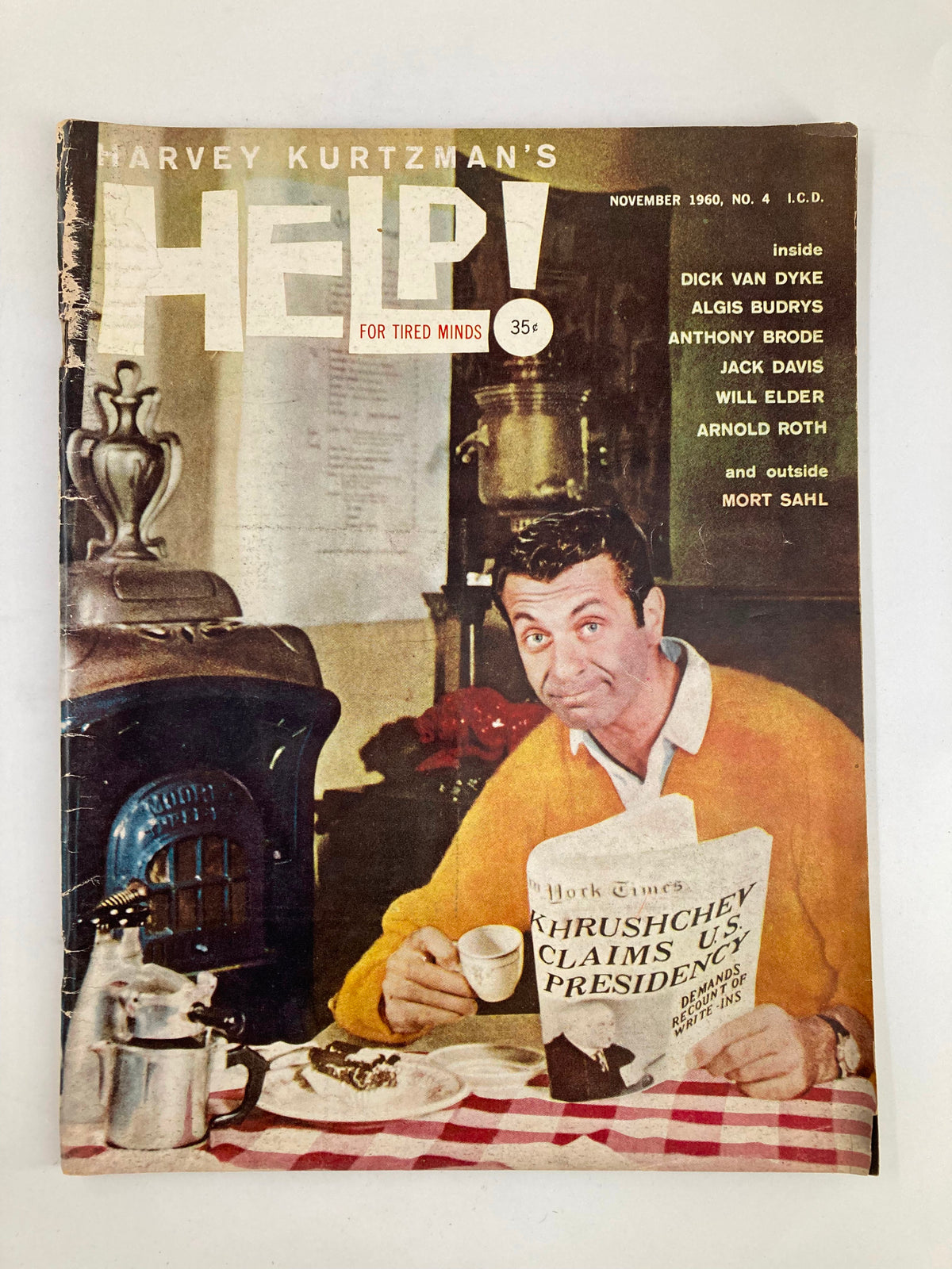 VTG Help Magazine November 1960 cover featuring a man holding a newspaper with the headline 'Khrushchev Claims U.S. Presidency'. The image depicts a vintage aesthetic reflective of the 1960s, showcasing the magazine's humorous theme and a cozy setting.