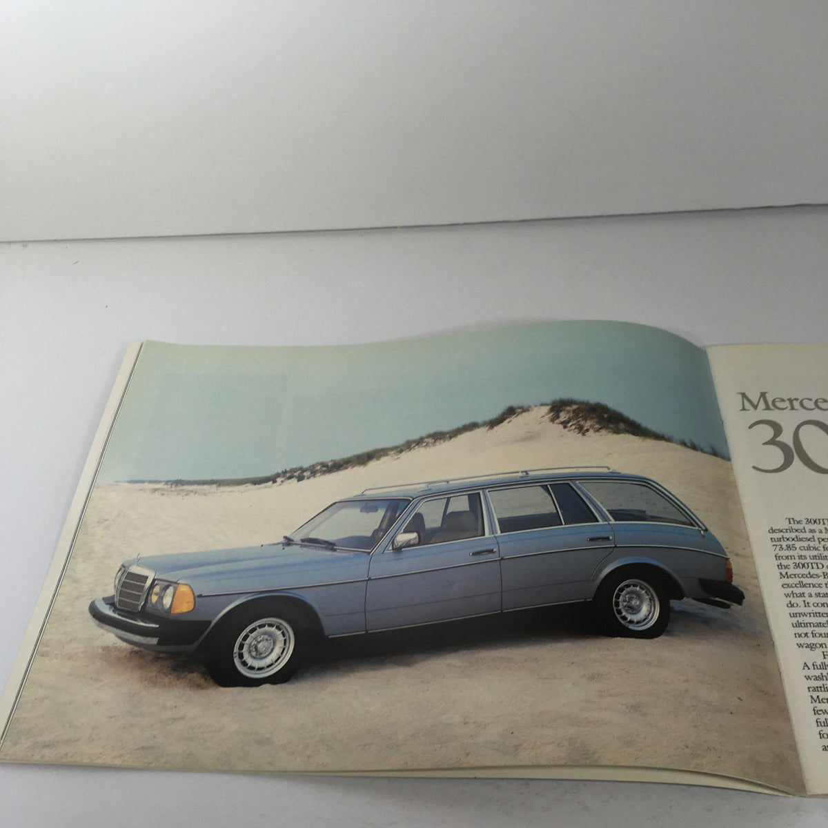 Another interior page of the 1982 Mercedes-Benz 300-Turbodiesel Dealership Car Auto Brochure showcasing the Mercedes 300TD parked on sandy terrain.