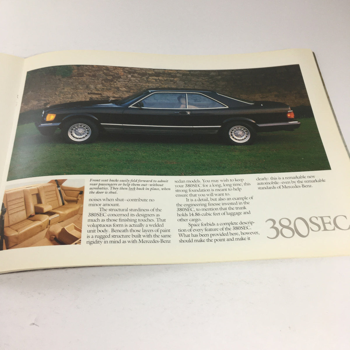 1982 Mercedes-Benz 300-Turbodiesel Dealership Car Auto Brochure Catalog featuring a black 380SEC car alongside an interior view, highlighting its sleek design and comfort.