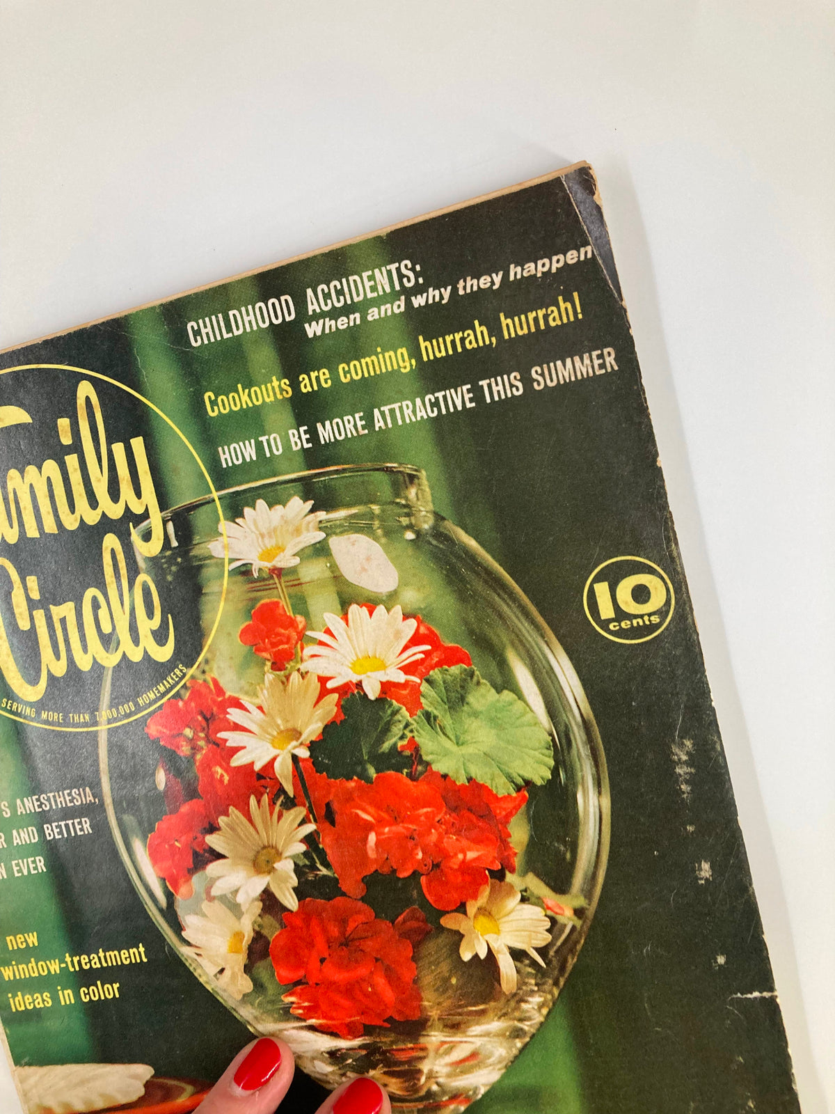 Close-up of the cover of VTG Family Circle Magazine June 1963 showing colorful flowers in a vase, with headlines about childhood accidents and summer beauty.