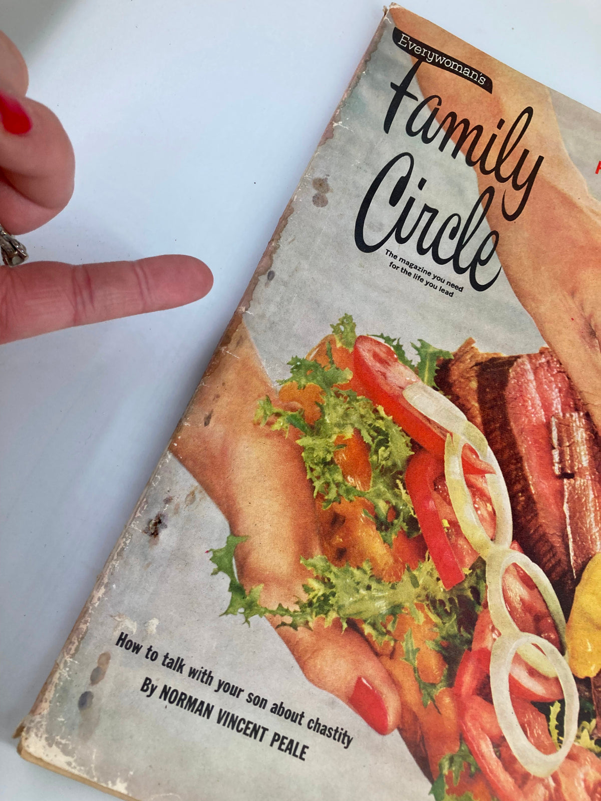 Detailed view of the Vintage Family Circle Magazine July 1958 cover, displaying the title 'Fun's A-Cookin' at the Barbecue' with a focus on the BBQ sandwich and fresh vegetables.