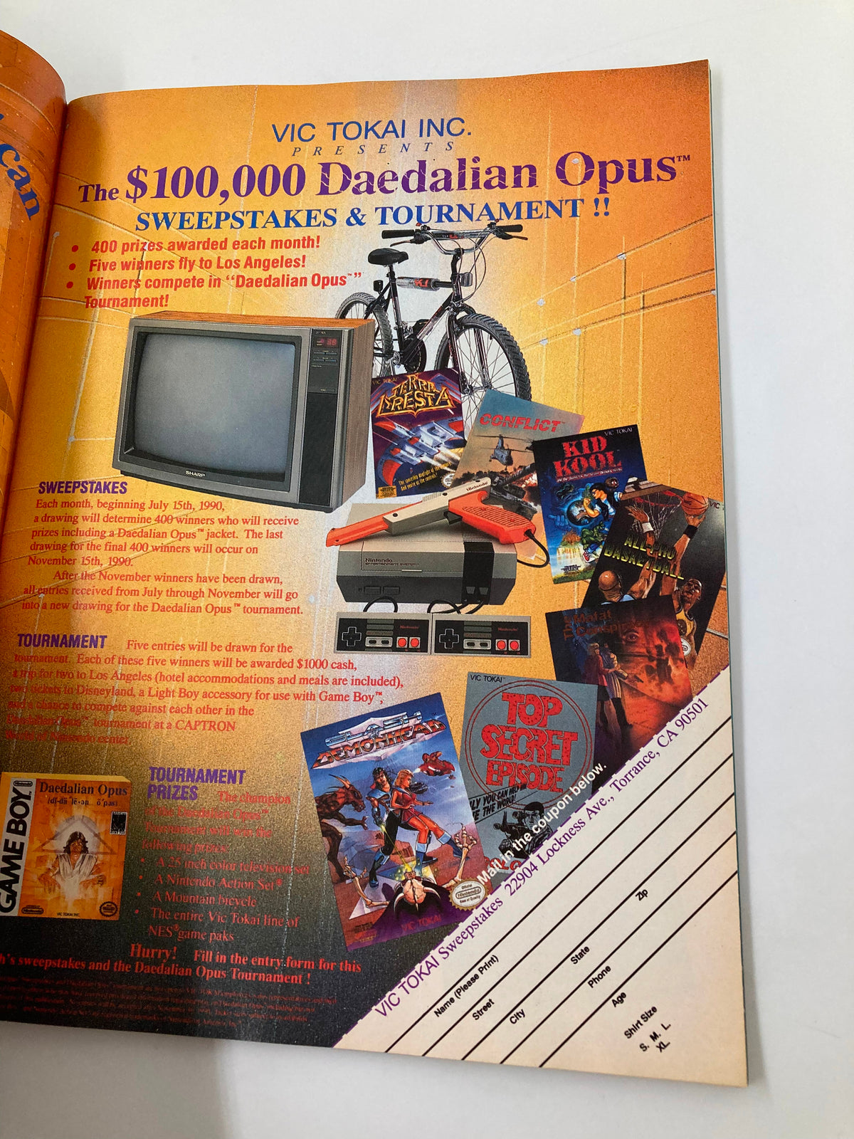 GamePro Magazine July 1990 featuring a colorful advertisement for the Vic Tokai $100,000 Daedalian Opus Sweepstakes and Tournament with various prizes displayed.