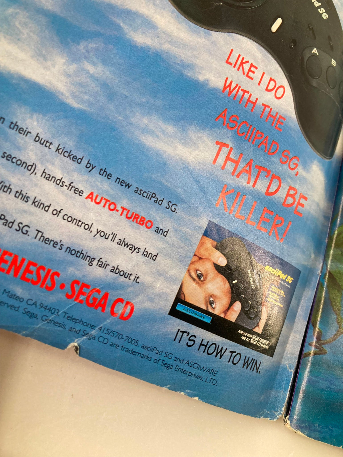 Advertisement in GamePro Magazine Vol 4 #12 featuring the asciiPad SG gaming controller, with a child holding it.