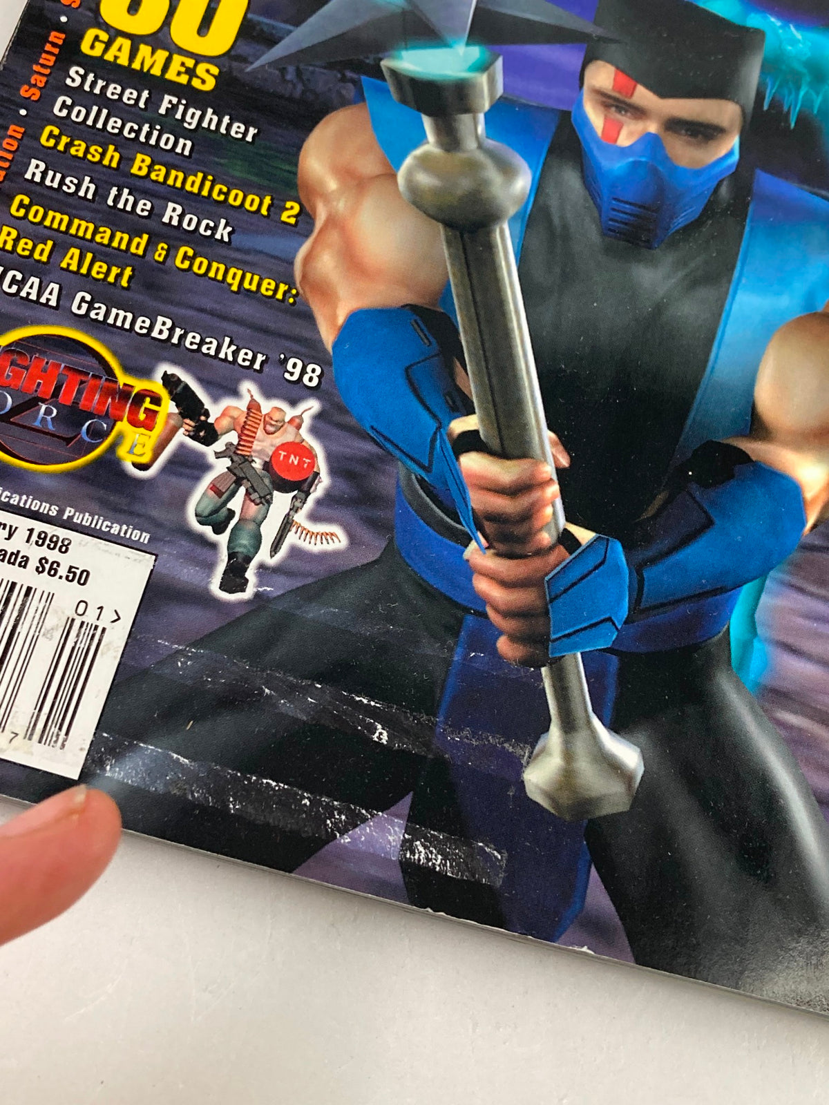 Close-up of the cover image from GamePro Magazine January 1998, highlighting Mortal Kombat 4 and featuring game reviews and collectibles from the issue.