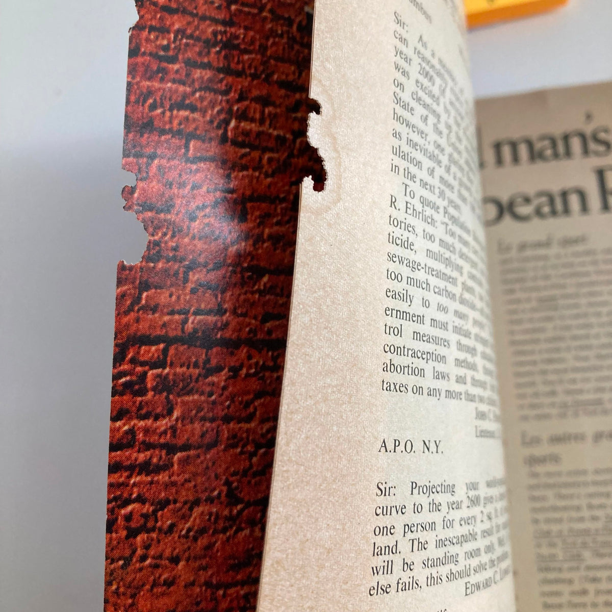 Detail view of a vintage Time Magazine from February 16, 1970, featuring Jane, Henry, and Peter Fonda, showing paper wear and tear.