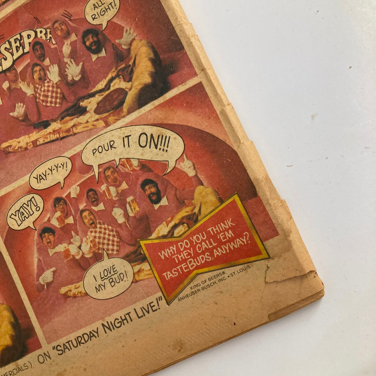 Close-up of a vintage Budweiser Tastebuds pizza advertisement comic strip. Features characters in festive attire enjoying pizza and beer, with dialogue about taste and fun. Related to the Rolling Stone Magazine August 9, 1979 issue highlighting Rickie Lee Jones.