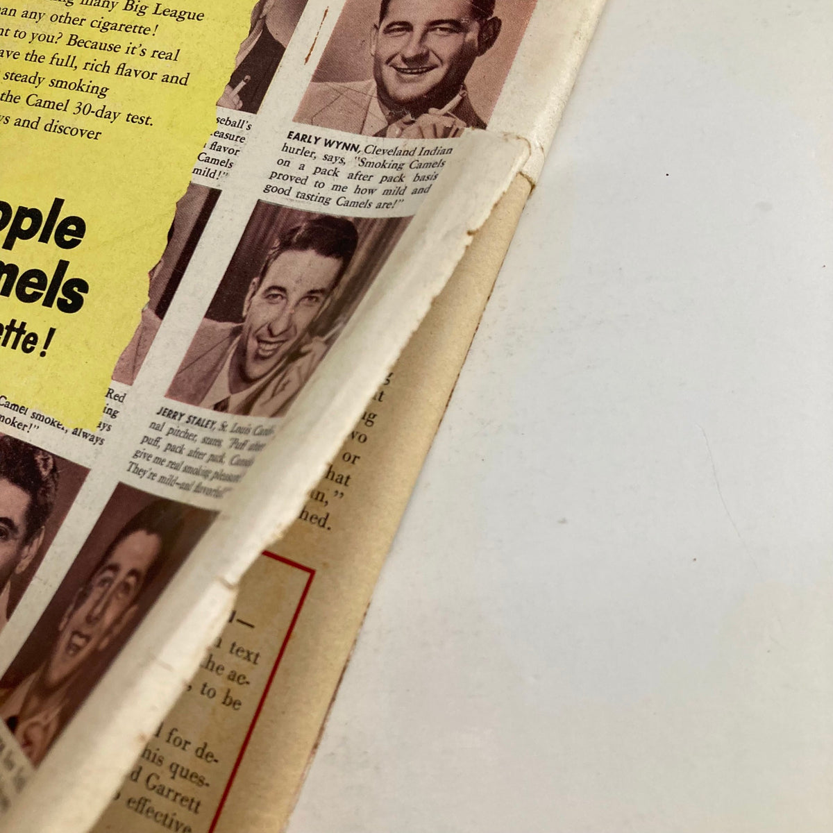 Close-up view of a vintage advertisement from VTG Look Magazine April 21 1953, showcasing Camel cigarettes with highlighted testimonials from famous personalities.