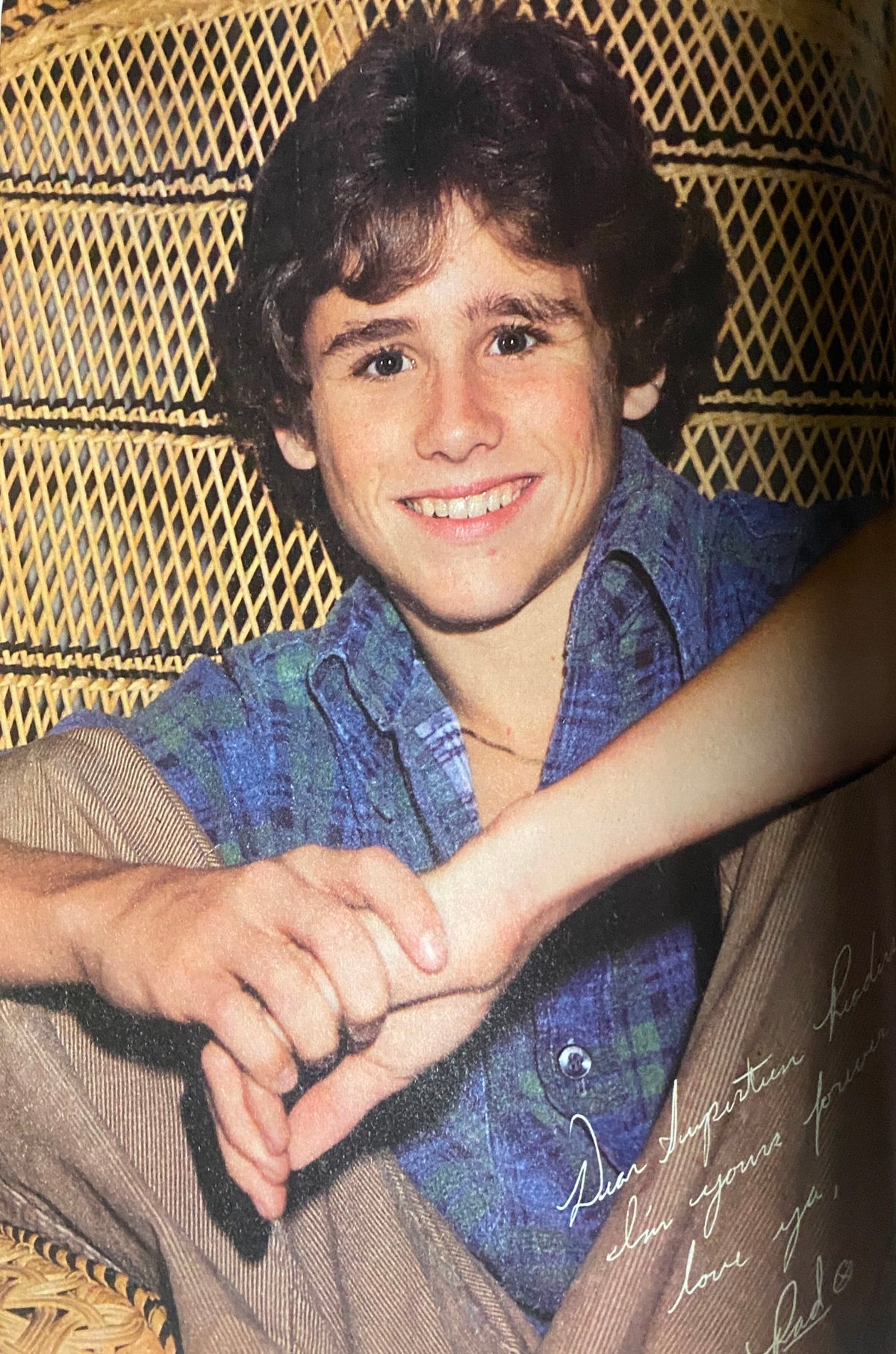 Smiling teenage boy in a blue plaid shirt, posing for SuperTeen Magazine June 1981 with a warm and inviting expression.