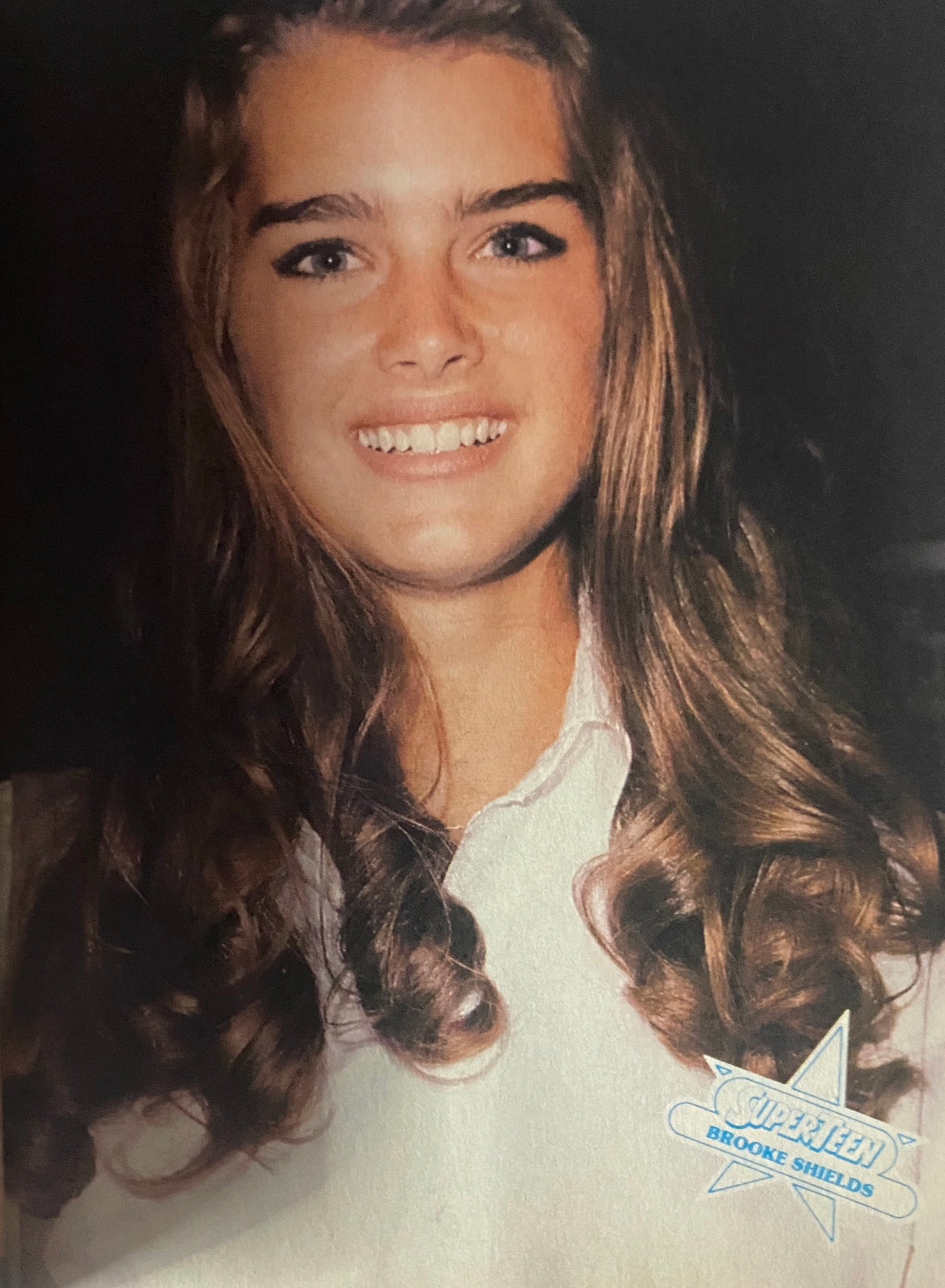 Portrait of Brooke Shields from SuperTeen Pinup Book No. 2, showcasing her long curls and youthful beauty in a classic 1980s style.