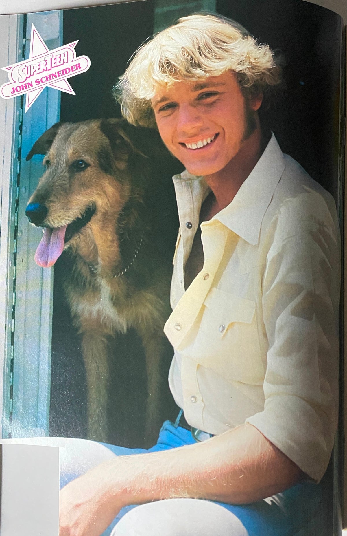 Vintage photo of John Schneider from SuperTeen Special No. 4, showcasing the actor smiling alongside a dog, embodying the charm of the 1981-1982 magazine.