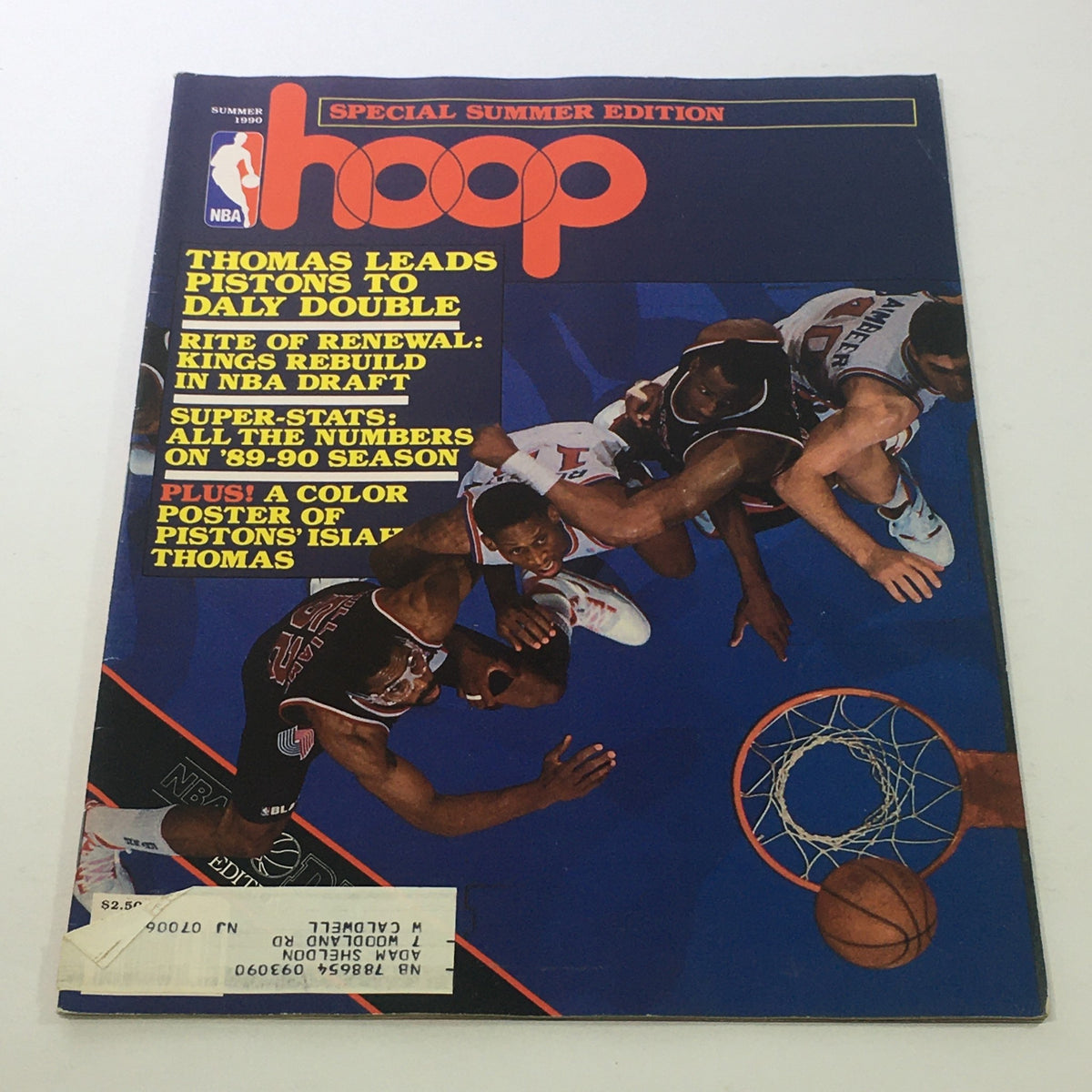 Hoop NBA Magazine: Summer 1990 cover featuring Isiah Thomas leading the Pistons to a Daly Double, highlighting basketball action with a colorful design and features on the NBA draft and season statistics.
