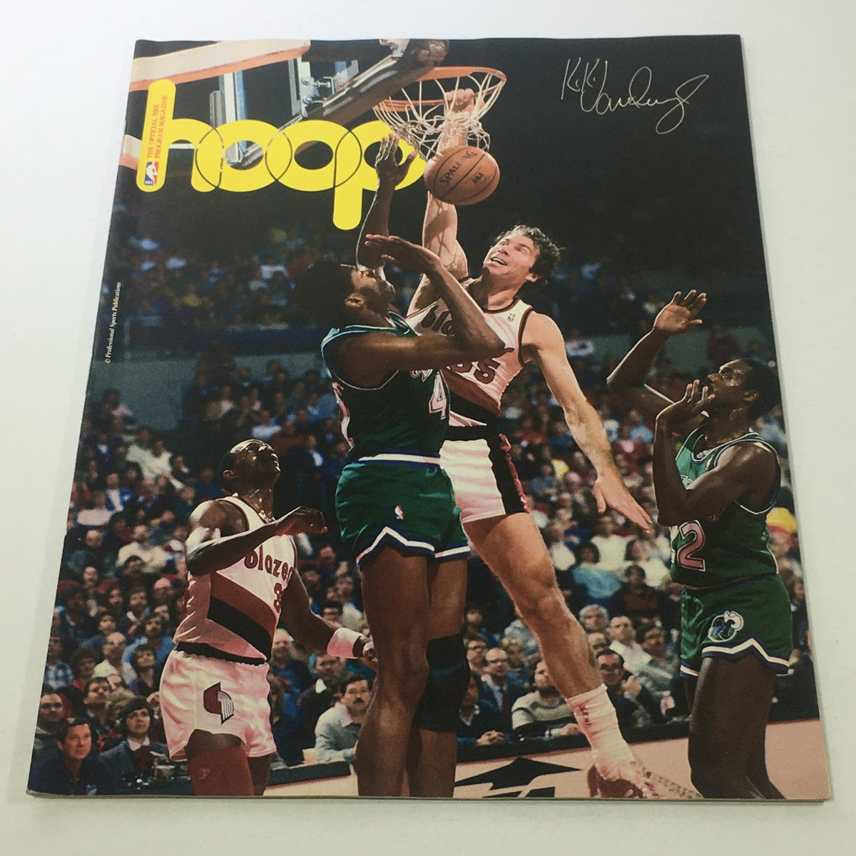 Hoop NBA Magazine featuring Ernest Maurice 'Kiki' VanDeWeghe III, showcasing a vintage basketball scene with players in action during the 1980s NBA era.