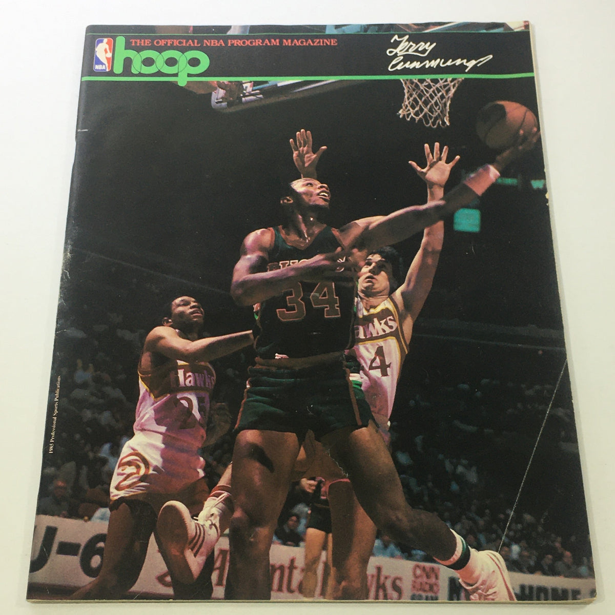 Hoop NBA Magazine featuring Terry Cummings from the 1980s, showcasing an intense basketball action scene with players in the heat of the game.