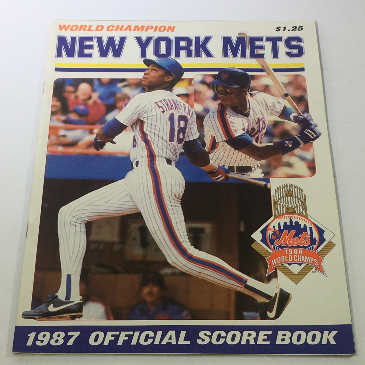 Cover of the New York Mets 1987 Official Score Book featuring Daryl Strawberry from the 1986 World Champions, showcasing the team's iconic colors and design.